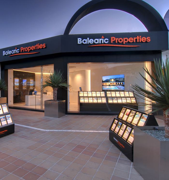 Entrance and window displays of the Balearic Properties office in Puerto Portals