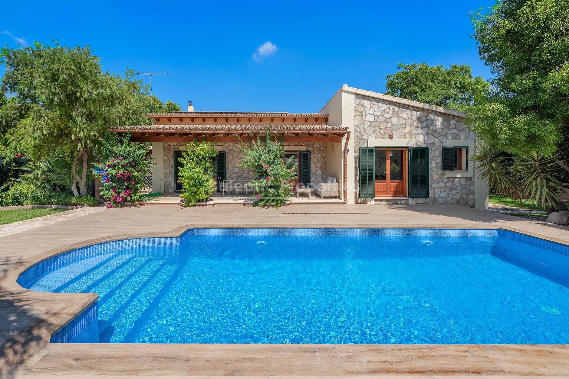 Family villa with attractive stone facade and pool for sale near Pollensa, Mallorca