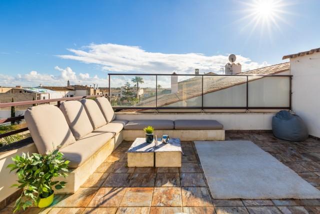 Townhouse with sunny roof top terrace for sale in the heart of Ses Salines, Mallorca