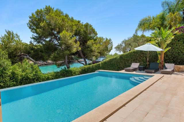 Frontline beach villa with sea views for sale in Cala d'Or, Southeast Mallorca