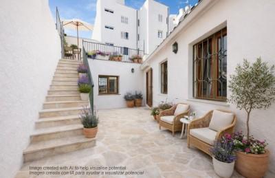 Patio mediterr&aacute;neo con terraza y flores IA