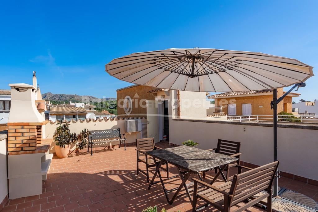 Spacious family home with ample roof terrace for sale in Puerto Alcúdia, Mallorca
