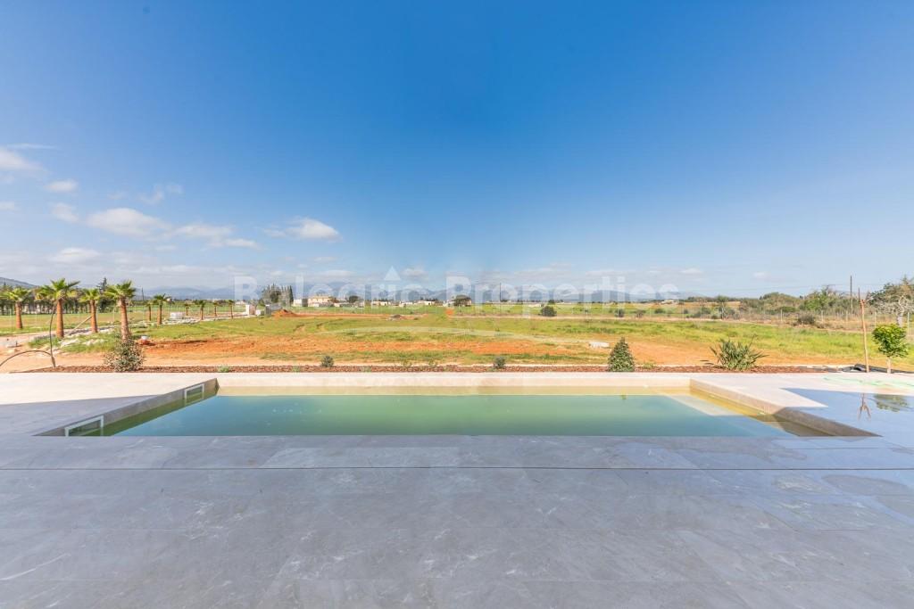 Moderna casa de campo con vistas panorámicas en venta en Llubí, Mallorca