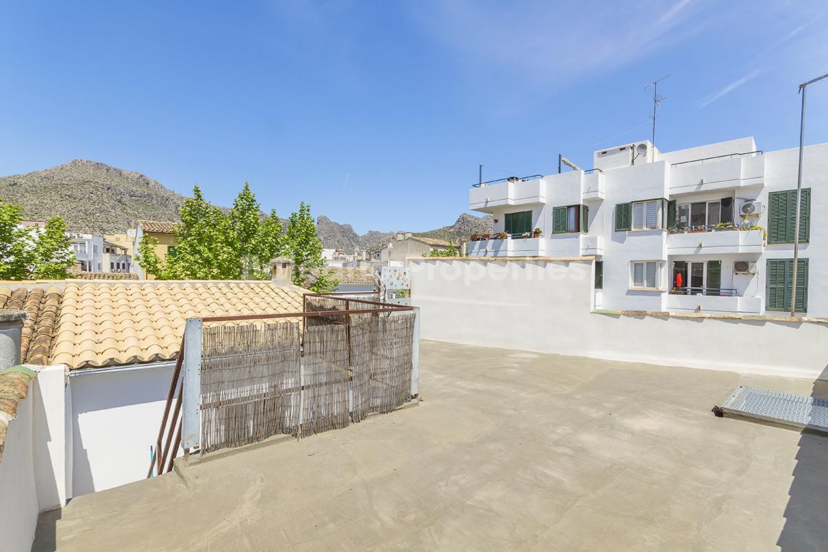 Refurbished village house with roof terrace for sale in Puerto Pollensa, Mallorca