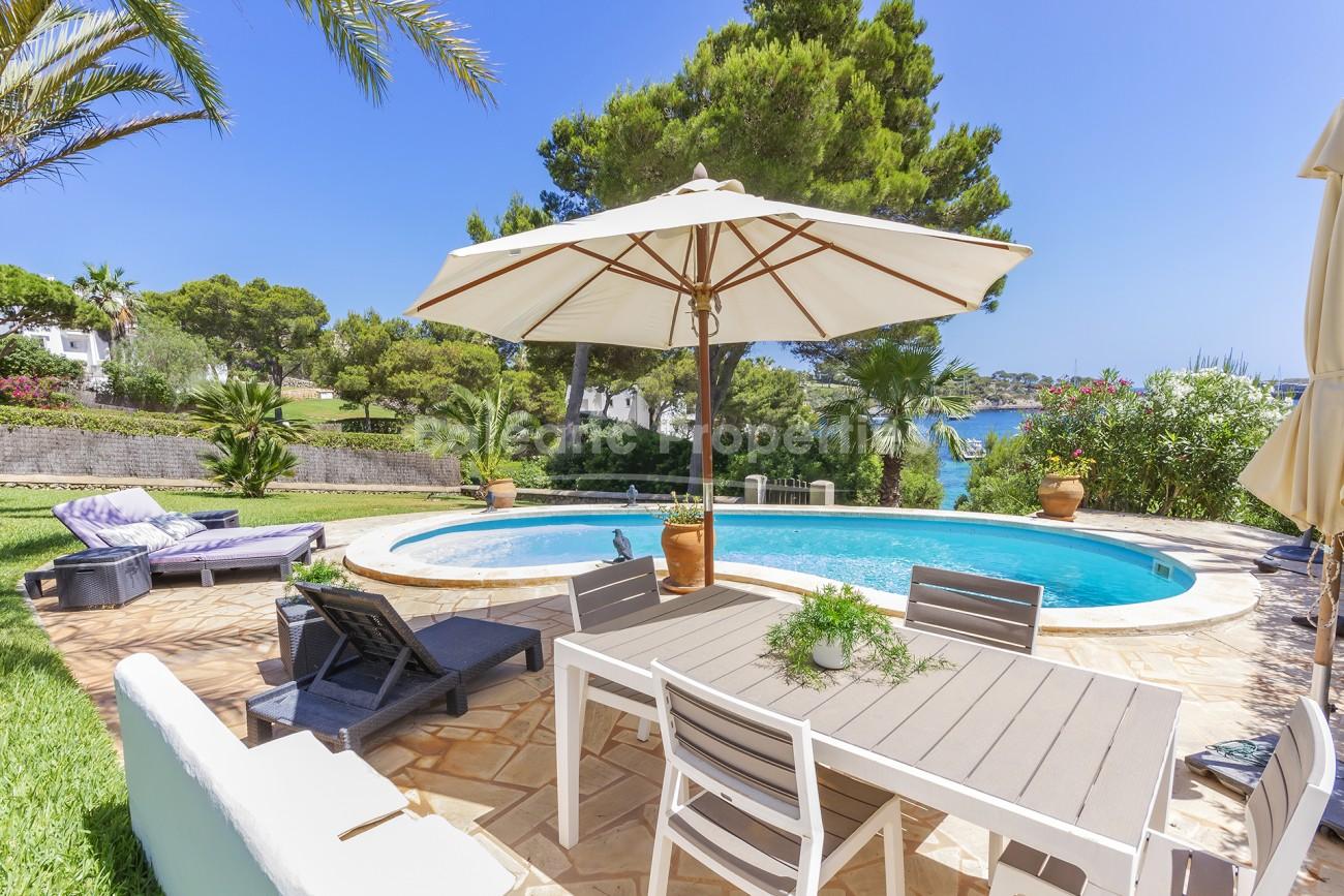 Idyllic front line villa with direct sea access for sale in Porto Petro, Mallorca